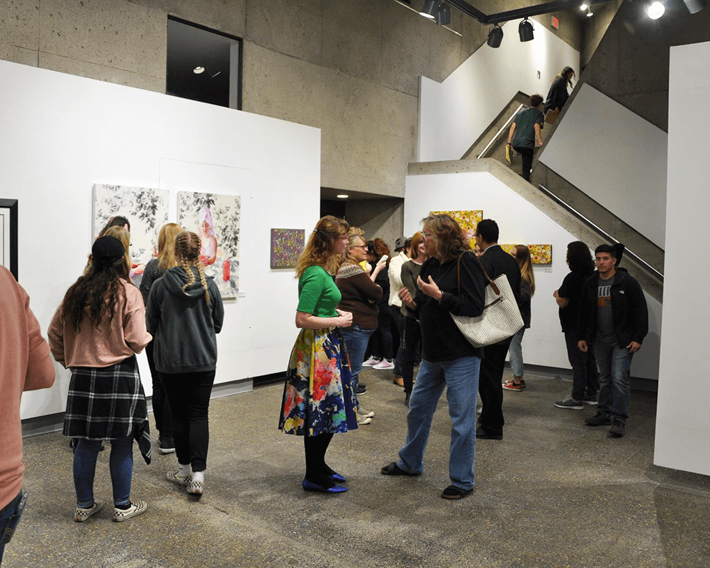 People in Esvelt Gallery viewing show installation